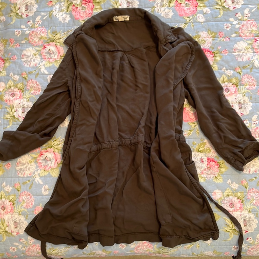 Soft, green, about a girl jacket/sweater